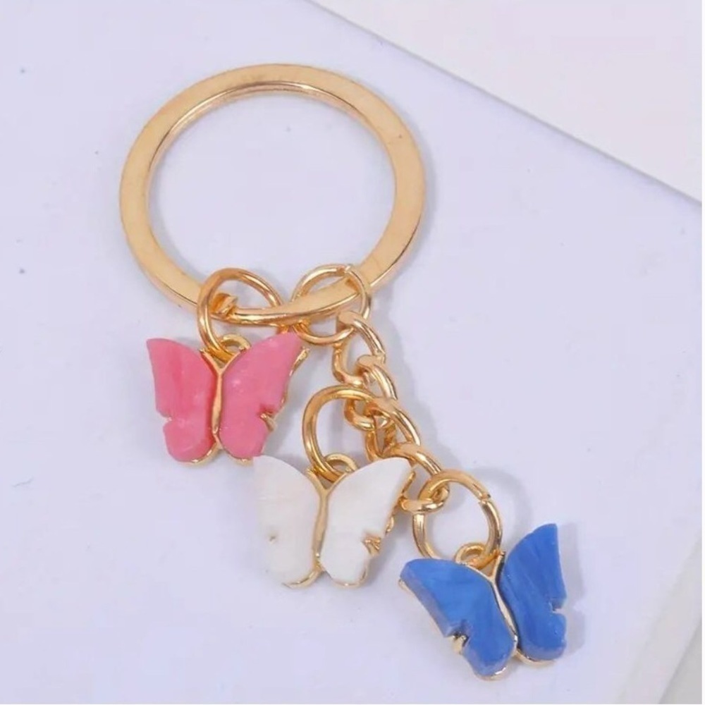 Three Butterfly Bag Charm Keychain with Pink, Blue, and White in Goldtone. NWT